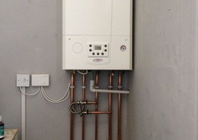 Utility room boiler with pipe connections